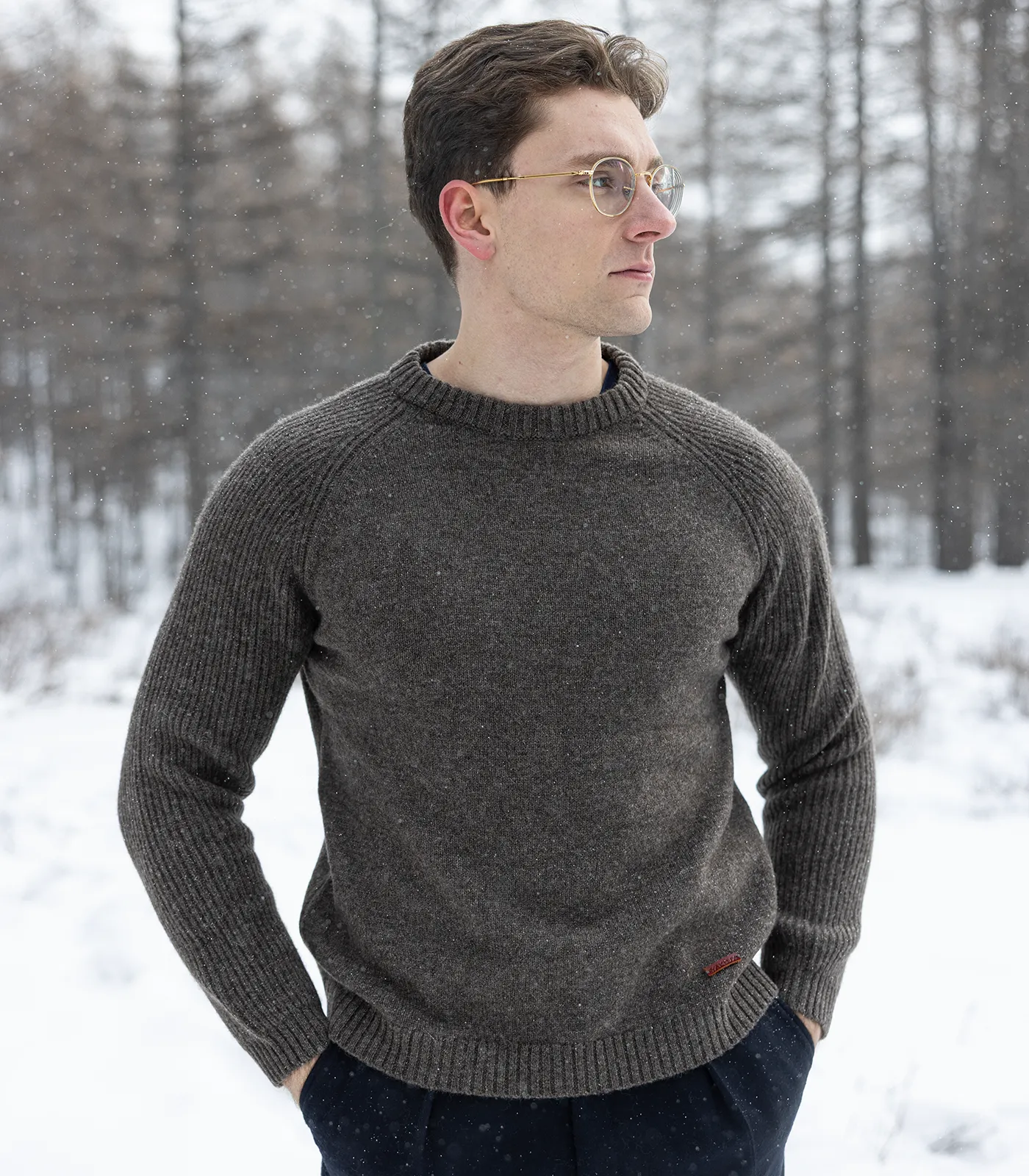Men wearing soft yak wool jumper in winter landscape