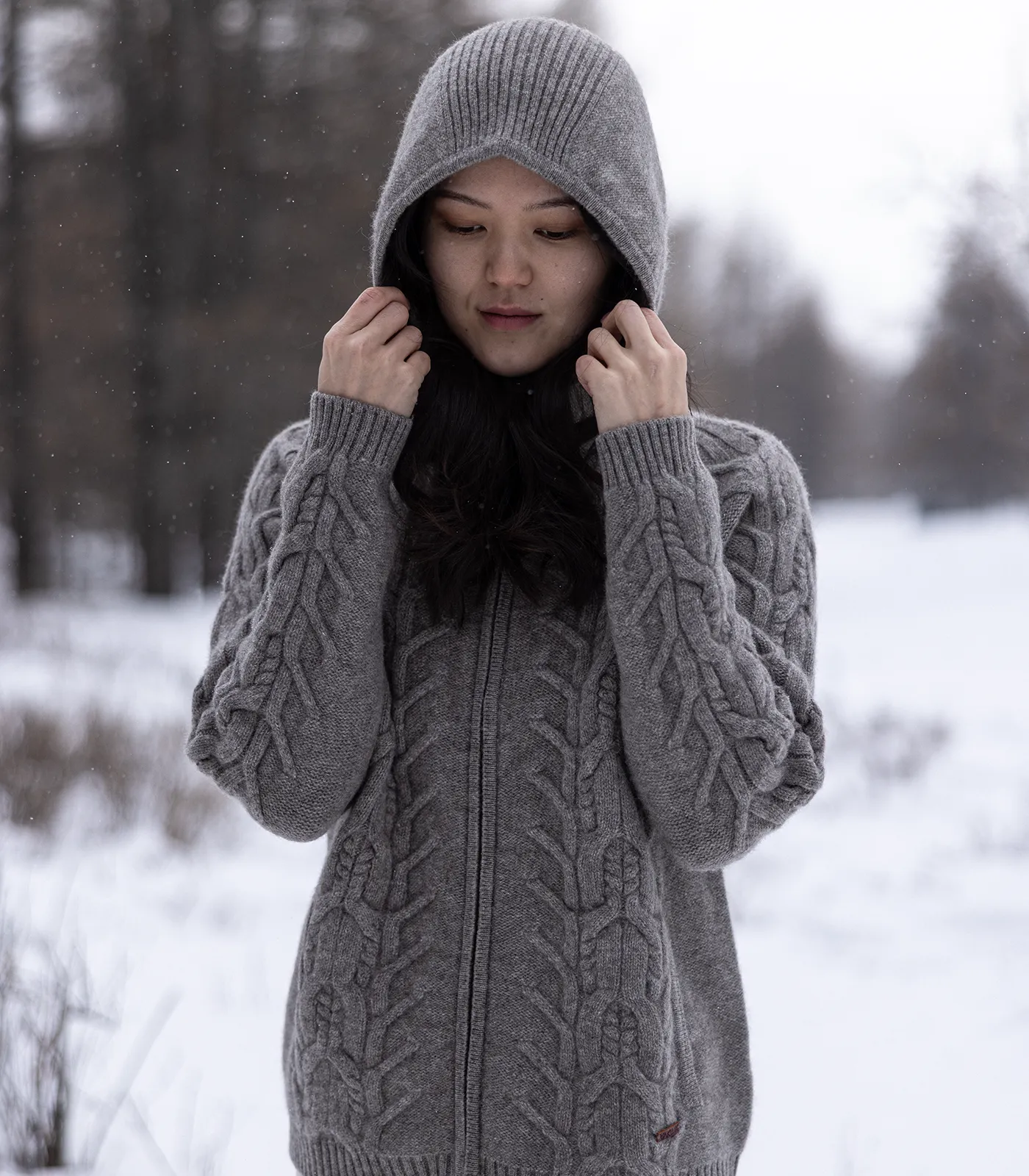 Women wearing oversized Mongolian yak wool hooded jumper in winter