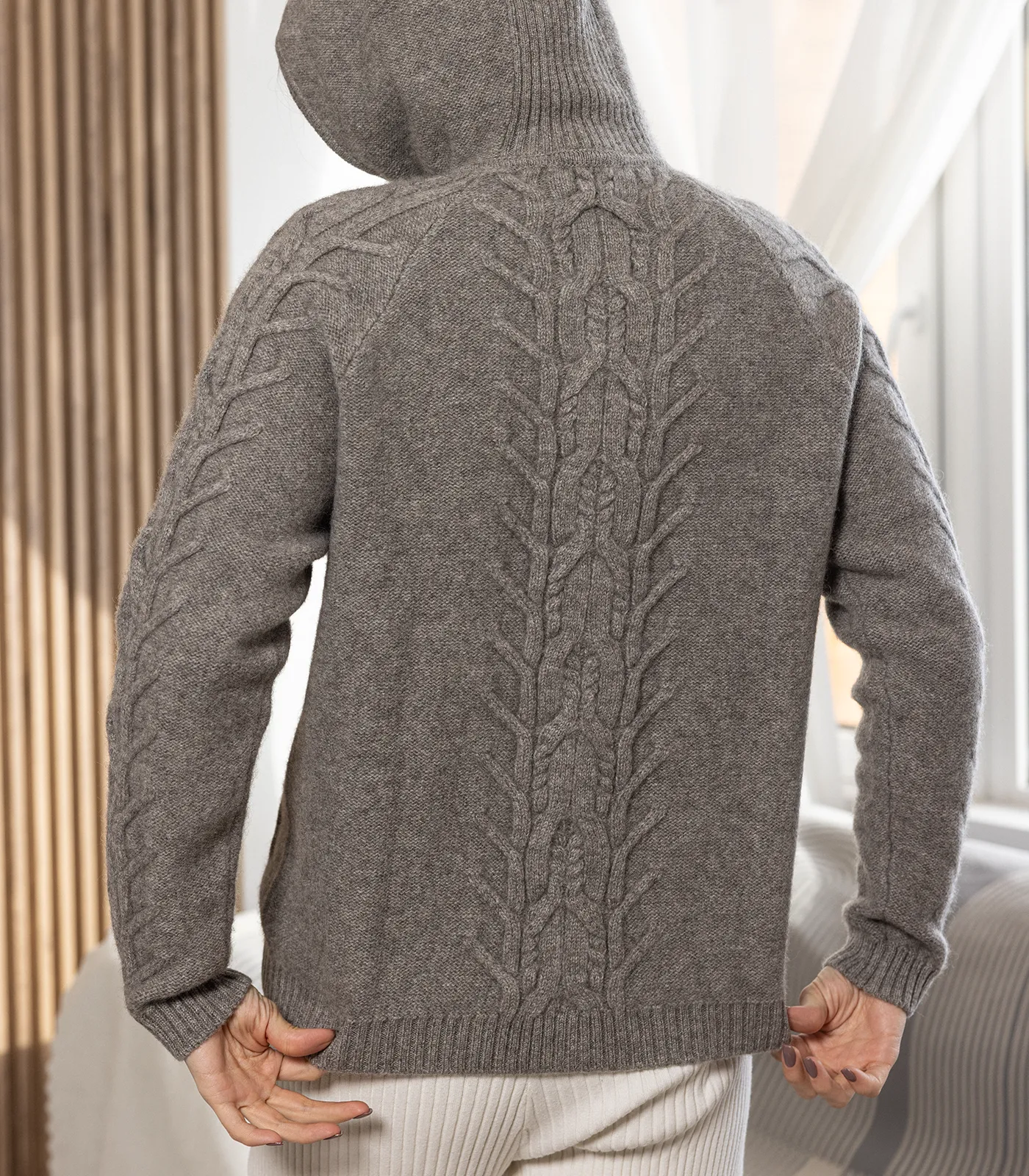 Back view of unisex yak wool hooded jumper with cable knit detail